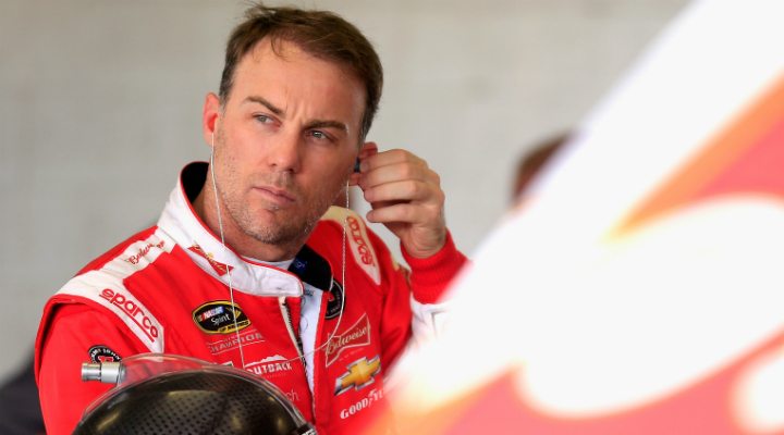 Harvick putting ear radio piece in