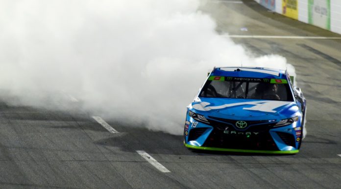 Martin Truex, Jr. doing a burnout at Martinsville with Auto Owners Paint Scheme