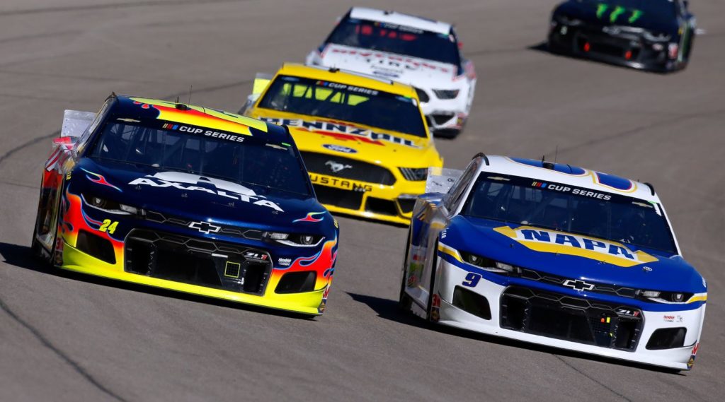 William Byron and Chase Elliott racing at Las Vegas Motor Speedway with Joey Logano and Brad Keselowski close behind