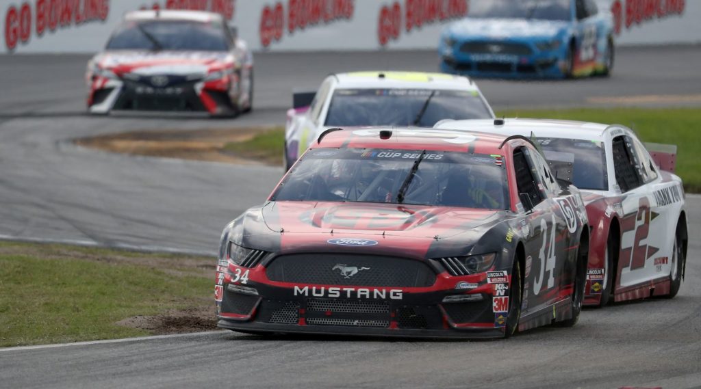 Michael McDowell and Brad Keselowski racing at the Daytona Road Course 2020