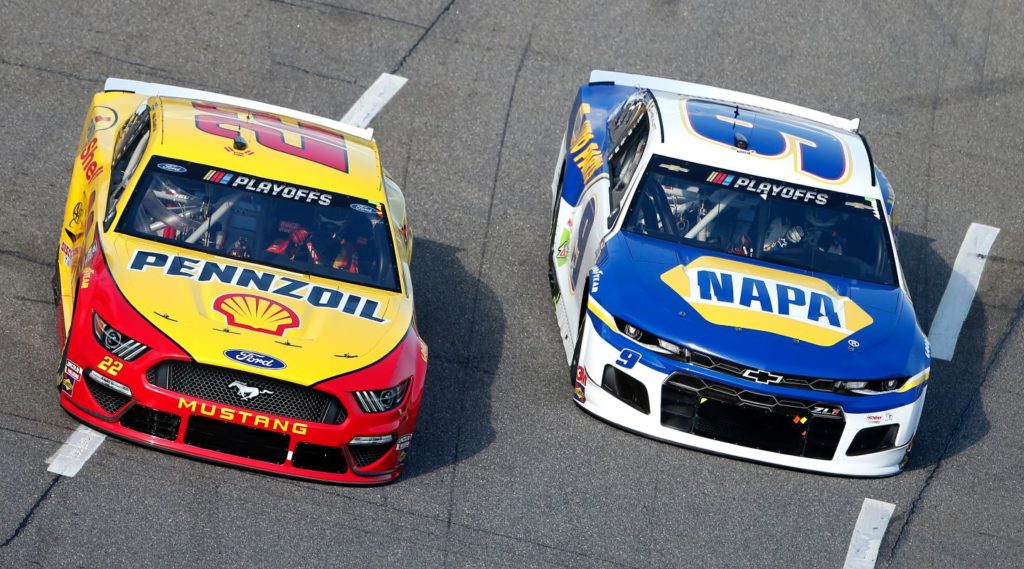 Joey Logano and Chase Elliott racing side by side in 2020 Playoffs