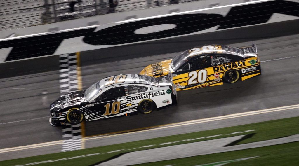 Aric Almirola and Christopher Bell racing at Daytona in the 2021 Duel race
