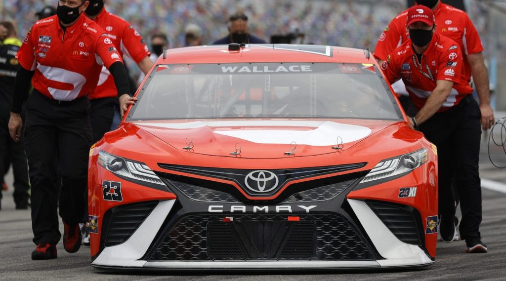 Bubba Wallace #23 Toyota being pushed to grid by team members