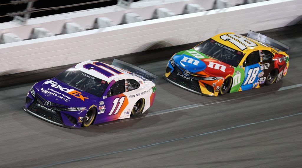 Denny Hamlin and Kyle Busch racing bumper to bumper during the 2021 Daytona 500