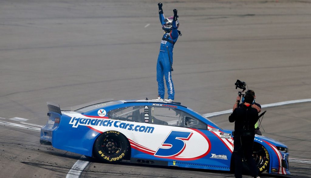 Kyle Larson celebrating with fists in air after winning Las Vegas race 2021