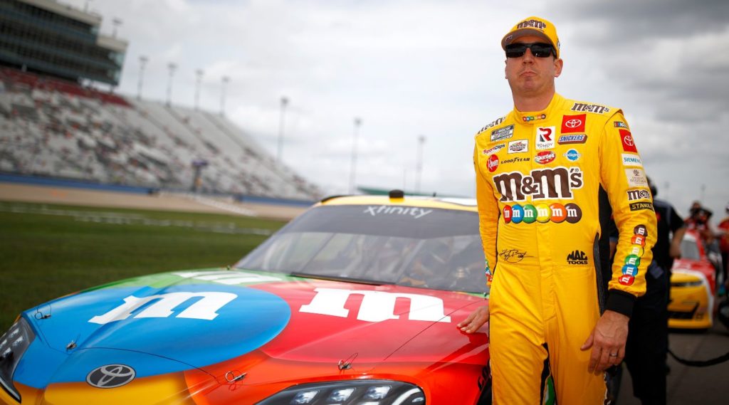 Kyle Busch in front of his M&Ms Toyota before winning his 100th Xfinity race