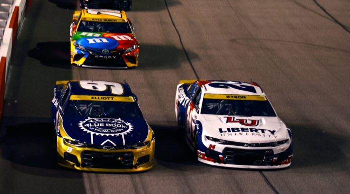 William Byron and Chase Elliott racing for position at Richmond with Kyle Busch behind them