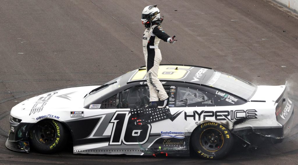 AJ Allmendinger, driver of the #16 Hyperice Chevrolet, celebrates after winning the NASCAR Cup Series Verizon 200 at the Brickyard at Indianapolis Motor Speedway on August 15, 2021 in Indianapolis, Indiana.