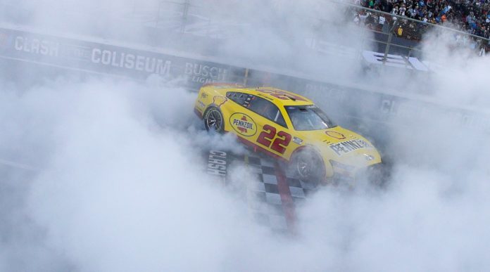 Joey Logano in the #22 Ford doing a burnout after winning the 2022 Busch Light Clash at the LA Coliseum