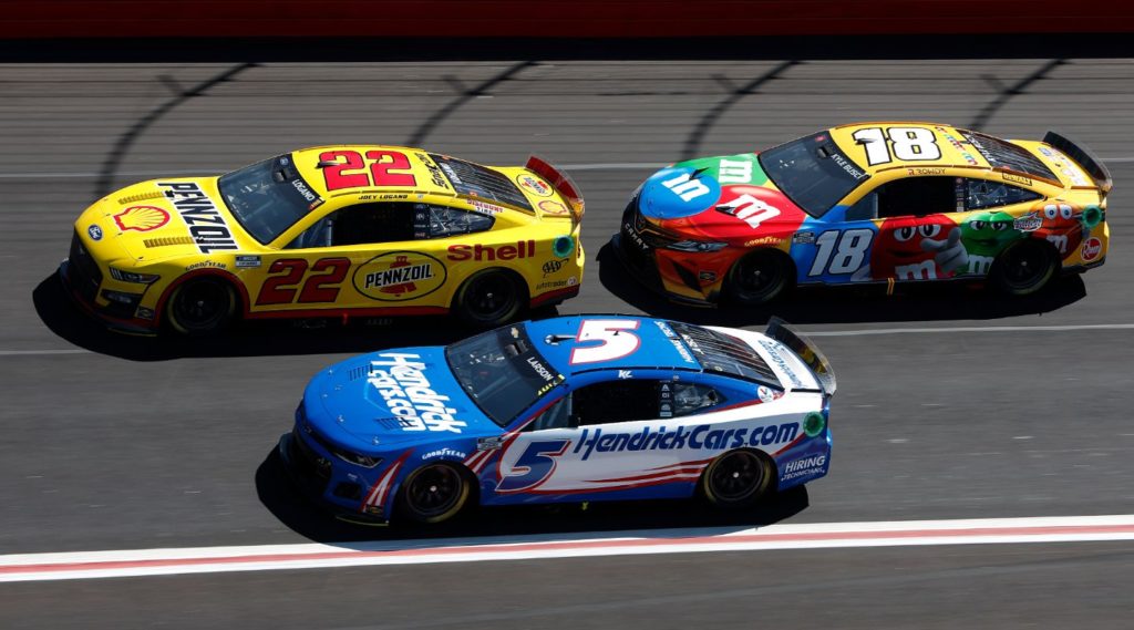 Joey Logano, Kyle Larson, and Kyle Busch practicing at Atlanta Motor Speedway